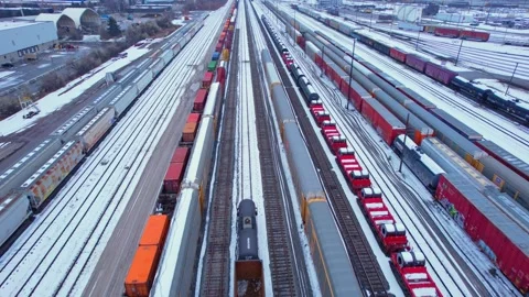 Freight train, laden with cargo along a railway in urban setting. Canadian .. Stock Footage 263685199