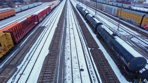 Freight train, laden with cargo along a railway in urban setting. Canadian .. Stock Footage 263685206