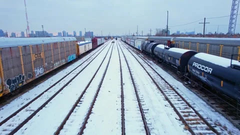 Freight train, laden with cargo along a railway in urban setting. Canadian .. Stock Footage 263685221