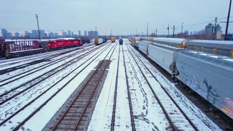 Freight train, laden with cargo along a railway in urban setting. Canadian .. Stock Footage 263685245