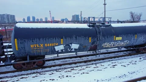 Freight train, laden with cargo along a railway in urban setting. Canadian .. Stock Footage 263685248