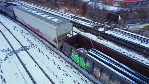 Freight train, laden with cargo along a railway in urban setting. Canadian .. Stock Footage 263685336