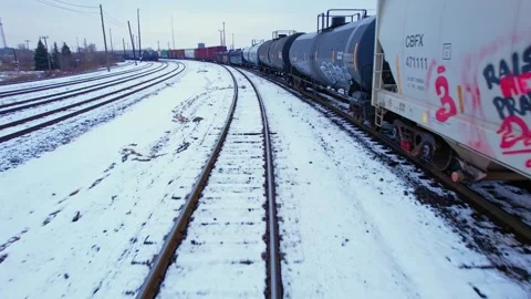 Freight train, laden with cargo along a railway in urban setting. Canadian .. Stock Footage 263685337