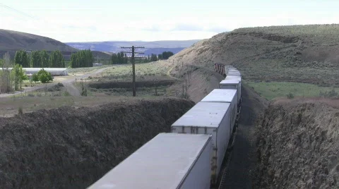 Freight  train leaving cut, overhead view Stock Footage 484847
