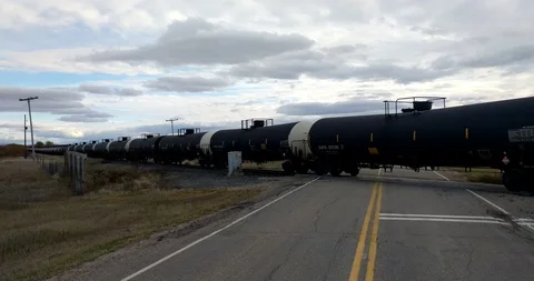 Freight Train at Level Crossing Stock Footage 97976628