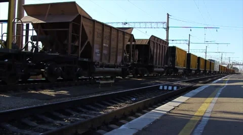 Freight train with many cargo containers runs on railway. Stock Footage 64636151