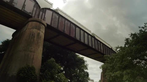 Freight Train Moves Along Elevated Bridge 스톡 동영상 53188855