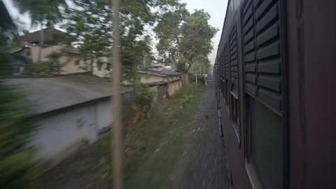 Freight Train Moves Fast in Suburbs of City along Urban Buildings. Stock Footage 118259243