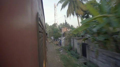 Freight Train Moves Fast in Suburbs of City along Slum Buildings. Stock Footage 118259611