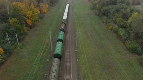 Freight train moves through the countryside Vídeo Stock 147644022