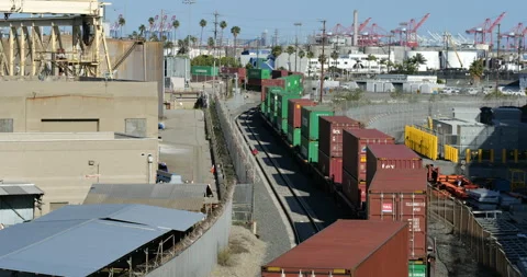 A freight train moves through the docks at the Port of Los Angeles Stock Footage 133644258