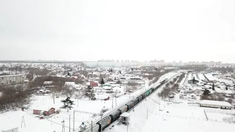 Freight train moves on winter roads Video stock 147032635
