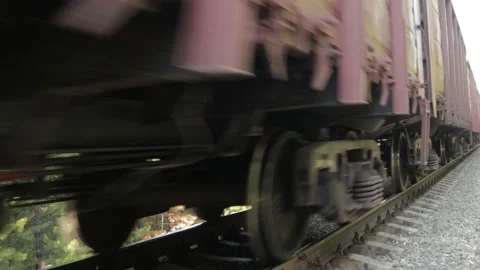 Freight train moving close in the forest Stock Footage 138654807