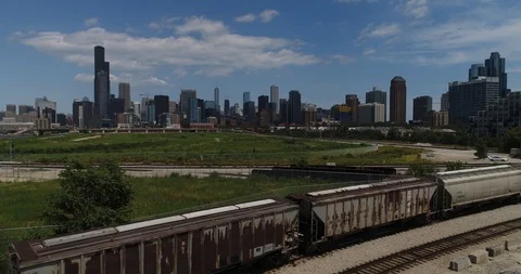 Freight Train Moving in front of Chicago Skyline Stock Footage 87475043