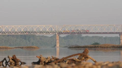 A Freight Train Is Moving over an Iron Bridge over the River. Amazing Shot. Stock Footage 197334951
