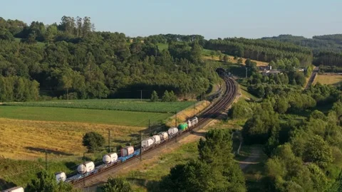 Freight Train Moving On Railroad Track Towards Tunnel Stock Footage 282795231