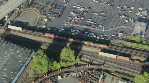 Freight Train Moving Through Urban Area Aerial Stock Footage 25363014