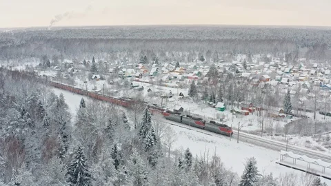 Freight train moving through winter forest 動画素材 117602846