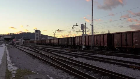 Freight train with open type cargo wagons waiting for departure Stock Footage 169608013