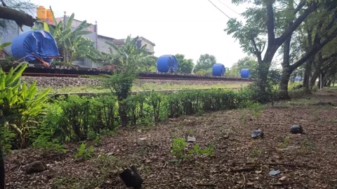 Freight train passed, carrying goods covered by blue tarpaulin. Stock Footage 274834745