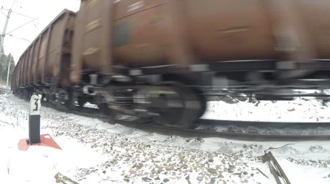 Freight train passes between two rocks. Highlands, Russia, winter Video stock 57221802