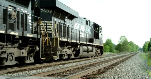 Freight Train Passes Frame to Horizon Stockbeeldmateriaal 92487475