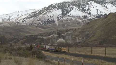 Freight Train Passes Industrial Cement Plant Stock Footage 22581006