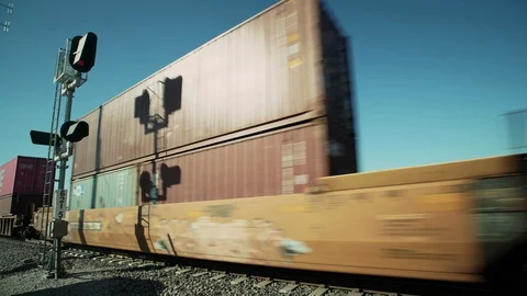 Freight train passes railroad crossing in the California desert &amp; the Salton Sea Stock-Footage 113649064