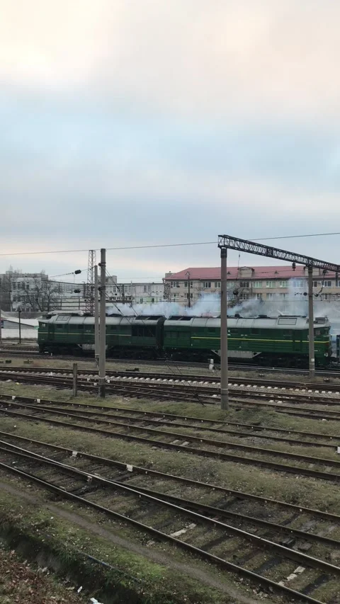 Freight train passes through the city, vertical video Stock Footage 159274862