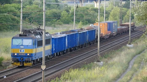Freight Train passes through the Countryside Stock Footage 39932288