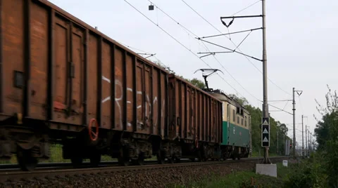 Freight Train passes through the Countryside Stock Footage 39932312