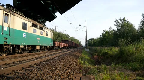 Freight Train passes under the Bridge Stock Footage 39932236