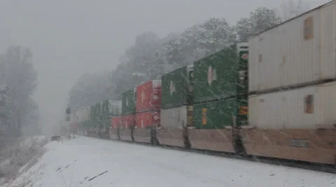 Freight Train Passes on a Wintry Day Stock Footage 37437469