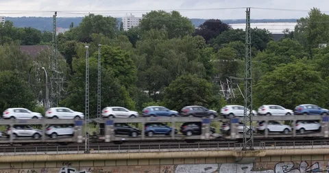 Freight Train Passing on Elevated Tracks Load Cargo Cars Transport in Dresden Stock Footage 96242037