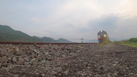 Freight train passing by with mountain view Video stock 240976634