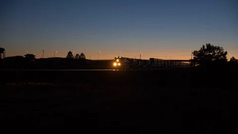A freight train passing by at night in a rural area Stock Footage 90450214