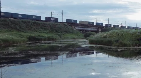 Freight Train passing over the bridge Stock Footage 65229567