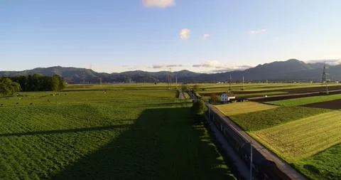 Freight train passing by on railroad Stock Footage 144188215