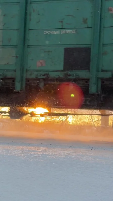 Freight Train Passing Railway Tracks in Winter at Sunset in Ukraine Stock Footage 327932766