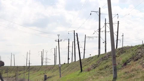 Freight train passing by the station on a sunny summer day close up Stock Footage 138175123