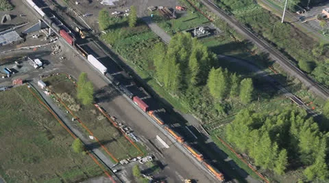 Freight Train Passing Through Commuter Station Aerial View Stock Footage 25363060