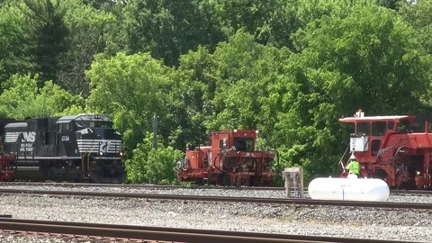 Freight Train Passing through a railway / railroad construction zone Stock Footage 81922505