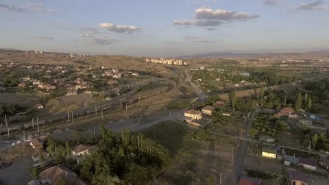 Freight train passing through the settlement Stock Footage 110845998