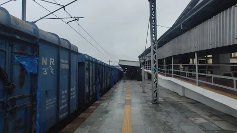 Freight train passing through Vadodara railway station, empty platform, India Stock Footage 345538742