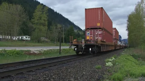 Freight Train Receding in Distance in British Columbia Stock Footage 11024222
