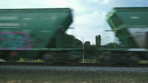 Freight train rides on railways. Freight train with wagons is riding across Stock Footage 137277707