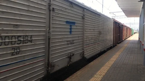 Freight train riding along the deserted platform Stock Footage 108070883