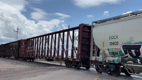 Freight train rolling past with sound Stock Footage 242956268