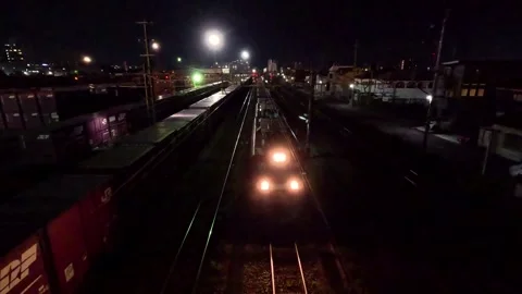 Freight train running at night Stock Footage 249311095