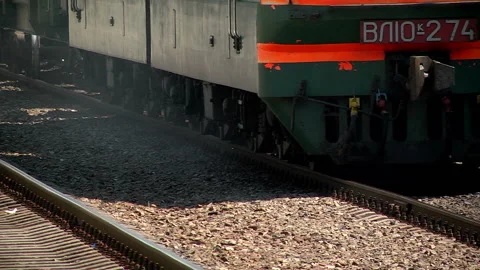 A freight train runs along the platform of the station Stock-Footage 98117979